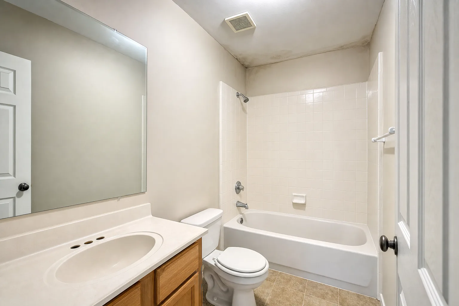 Third-floor hallway bathroom in a vacant York County townhouse evaluated during a real estate mold inspection.